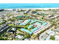 Breathtaking aerial view of the property's location with beach access and community amenities at 5669 Midnight Pass Rd # 308, Sarasota, FL 34242
