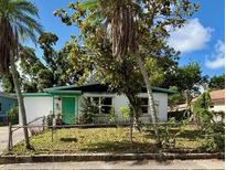Charming single-story home with a well-maintained lawn and mature landscaping at 1758 35Th St, Sarasota, FL 34234