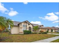 Charming single-story home featuring a stucco exterior, arched entry, and well-manicured landscaping at 4621 34Th E Ct, Bradenton, FL 34203