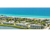 Beautiful aerial view of beachside condos and pristine blue ocean waters at 4840 Gulf Of Mexico Dr # Villa 15, Longboat Key, FL 34228