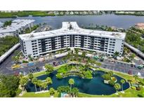 Beautiful condominium complex surrounded by lush landscaping and stunning water features and ample parking at 5855 Midnight Pass Rd # 621, Sarasota, FL 34242
