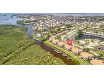 Waterfront condo community with private boat docks and lush tropical landscaping at 8710 54Th W Ave # 8710, Bradenton, FL 34210