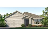Charming single-story home featuring an attached two car garage, neutral paint, and front landscaping at 12079 Mountain Island Trl, Parrish, FL 34219