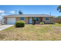 Charming single-story home featuring a well-maintained lawn and a one-car garage at 1533 Olympia Rd, Venice, FL 34293