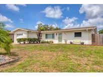 Charming single-story home with a well-maintained lawn, white exterior, and a welcoming front entrance at 2402 33Rd W St, Bradenton, FL 34205