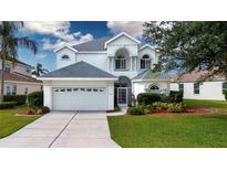 Inviting two-story home boasting a well-manicured lawn and charming architectural details at 6307 Laurel Creek Trl, Ellenton, FL 34222