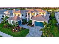 Stunning home with a paver driveway, meticulous landscaping, and a three-car garage at 8272 Redonda Loop, Bradenton, FL 34202