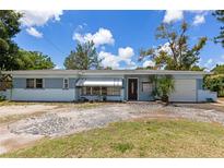 Charming single-story home with a light blue exterior, well-maintained lawn, and inviting curb appeal at 5916 Gulfport S Blvd, Gulfport, FL 33707