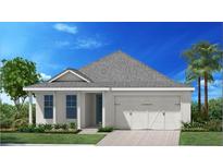 Charming one-story home featuring a two-car garage, well-manicured lawn, and lush landscaping at 9164 Florida Rock Trl, Sarasota, FL 34240