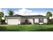 Charming single-story home with a two-car garage, landscaped yard, and inviting curb appeal at 22318 Alcorn Ave, Port Charlotte, FL 33952