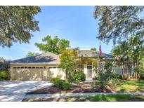 Lovely single-story home featuring a three-car garage, well-manicured landscaping, and an inviting facade at 2809 112Th E Ter, Parrish, FL 34219