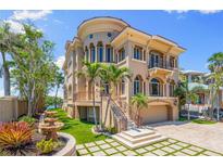 Stunning Mediterranean-style home with a multi-level design, grand staircase and beautiful landscaping at 290 N Washington Dr, Sarasota, FL 34236