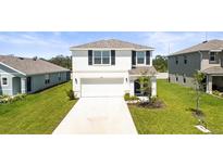 Charming two-story home with a well-manicured lawn and inviting front entrance at 3108 Rock Sound St, Bradenton, FL 34208