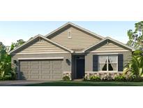 Charming single-Gathering home with stone accents, attached garage, and manicured landscaping at 18303 Wheathouse Pl, Lakewood Ranch, FL 34211