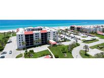 Beautiful beachside condos boast lush landscaping and easy beach access for relaxed coastal living at 1945 Gulf Of Mexico Dr # M2-313, Longboat Key, FL 34228