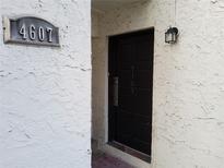 Inviting front entrance with a dark-colored door and house number displayed at 4607 W North B St # 105, Tampa, FL 33609