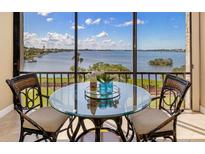 Cozy breakfast nook on balcony with breathtaking water view at 1608 Stickney Point Rd # 304, Sarasota, FL 34231