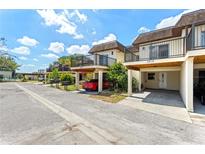 Charming townhomes with individual carports and balconies offer a community feel with private outdoor spaces at 3212 Ramblewood N Dr # 3212, Sarasota, FL 34237