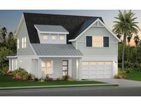 Charming two-story home with a covered front porch, a two-car garage, and well-manicured landscaping at 655 Maldives Trl, Sarasota, FL 34234