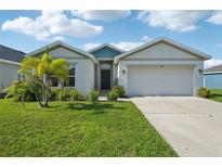 Charming single-story home with a well-manicured lawn and a two-car garage at 4503 Lindever Ln, Palmetto, FL 34221
