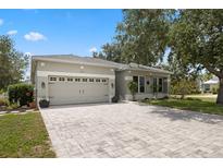Charming single-story home with a paved driveway, attached garage, and well-maintained landscaping at 318 39Th Ne St, Bradenton, FL 34208