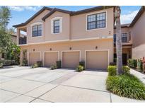 Beautiful townhome featuring a three-car garage and a well-maintained exterior at 4220 Via Piedra Cir # 4-101, Sarasota, FL 34233