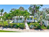 Charming home surrounded by tropical landscaping and well-manicured green spaces at 643 Calle Del Otono, Sarasota, FL 34242
