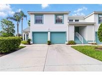 Inviting two-story condo with attached garage and a well-manicured lawn at 6572 Fairway Gardens Dr # 6572, Bradenton, FL 34203