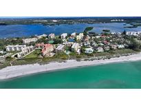 Stunning aerial view of beachfront condos with a pool and Gulf access at 8779 Midnight Pass Rd # 506H, Sarasota, FL 34242