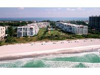 Beautiful beachfront condo buildings offer stunning views and private beach access to residents at 1465 Gulf Of Mexico Dr # 502, Longboat Key, FL 34228