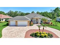 Beautiful, well-maintained home with a circular driveway and a three-car garage at 15006 21St E Ave, Bradenton, FL 34212