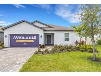 Charming single-story home featuring manicured landscaping and a welcoming front entrance, ready for quick move-in at 5213 Patano Loop, Palmetto, FL 34221