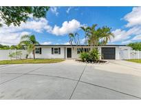 Charming single story home features well maintained landscaping, fresh white paint and modern black accents at 3808 Cape Vista Dr, Bradenton, FL 34209