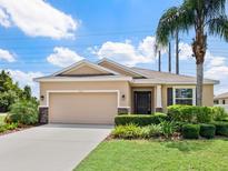 Charming single-story home featuring a well-maintained lawn and a beautifully landscaped front yard at 4615 73Rd E St, Bradenton, FL 34203