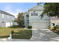 Charming two-story home with manicured lawn, two car garage, and beautiful curb appeal in a lovely neighborhood at 5224 58Th E Ter, Bradenton, FL 34203