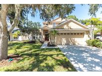 Charming two-story home boasts a well-manicured lawn and inviting front entrance at 6032 36Th E Ct, Ellenton, FL 34222