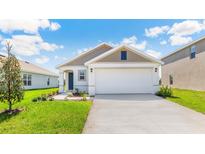 Charming single-Gathering home with a well-manicured lawn and a spacious two-car garage at 10718 Hidden Banks Gln, Parrish, FL 34219