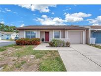 Charming home featuring a well-kept lawn, colorful shrubbery, and a private driveway at 4116 43Rd W Ave, Bradenton, FL 34205