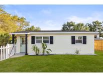 Charming bungalow featuring a well-manicured lawn and inviting front entrance at 5045 10Th S Ave, Gulfport, FL 33707