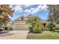 Charming single-Gathering home boasting a well-manicured lawn and a convenient two-car garage at 11714 Forest Park Cir, Bradenton, FL 34211