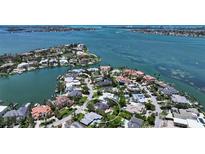 Stunning aerial view of waterfront homes with lush landscaping on a sunny day at 1387 Harbor Dr, Sarasota, FL 34239