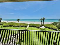 Beautiful balcony view overlooking the beach and Gulf of Mexico at 2675 Gulf Of Mexico Dr # 203, Longboat Key, FL 34228