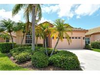 Charming single-story home with lush landscaping and a two-car garage at 3804 Amapola Ln, Sarasota, FL 34238