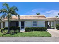 Charming one-story home with a well-manicured lawn and a covered carport, perfect for relaxed living at 6150 Midnight Pass Rd # V4, Sarasota, FL 34242