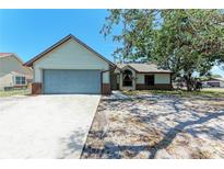 Charming single-story home featuring a two-car garage, neutral siding and inviting front yard at 6332 7Th E Ct, Bradenton, FL 34203