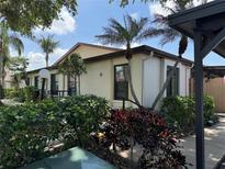 Charming villa with lush landscaping and a well-maintained exterior in a sunny neighborhood at 2841 74Th St W # 2841, Bradenton, FL 34209