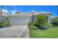 Charming single-Gathering home with a two-car garage, tile roof, and beautifully landscaped front yard at 4220 Miriana Way, Sarasota, FL 34233