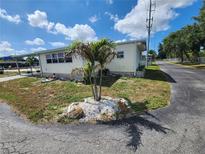 Attractive single-story home with a landscaped yard, showcasing a tranquil neighborhood setting at 5301 Algeria Ct, Bradenton, FL 34207