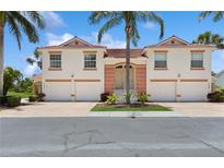 Charming townhome with a red-tile roof, white exterior and two-car garage at 7532 Marsh Orchid Cir # 8-201, Bradenton, FL 34203