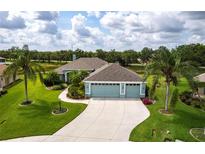 Inviting home with well-manicured lawn, lush landscaping, and a spacious three-car garage at 9017 Province St, Sarasota, FL 34240